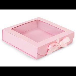 Pink folding box with window and ribbon closures